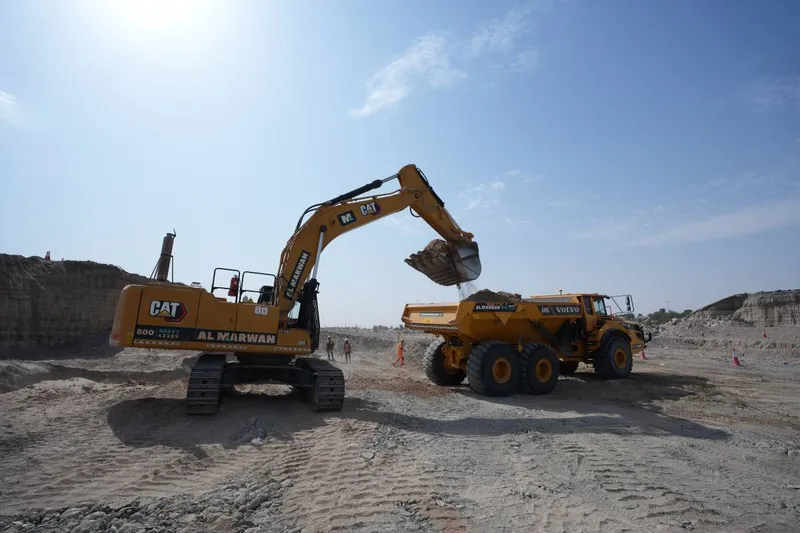 cat excavator and volvo ADT