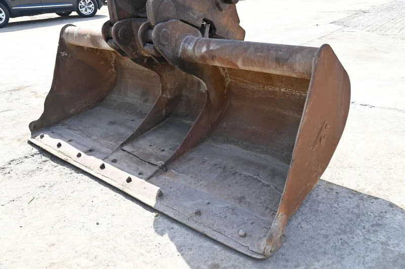 A wide grading bucket fitted on a KOBELCO SK200 mini excavator attachments for grading