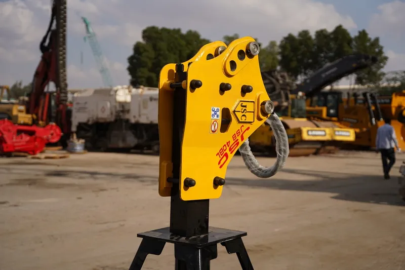 Jisung (JSC) 20GT BL jackhammer used as a machinery attachment for a backhoe loader