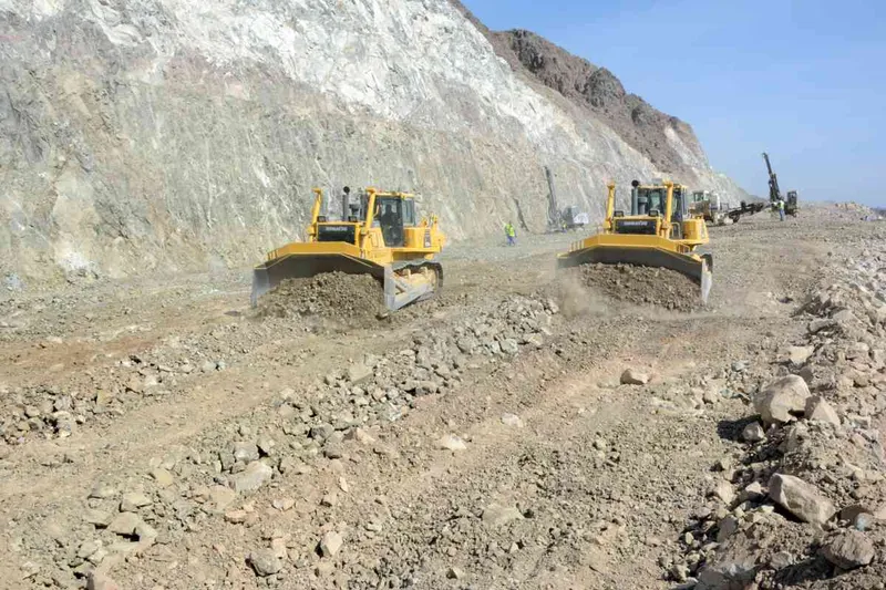 A pair of Komatsu bulldozers