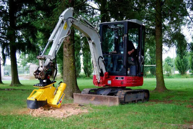 Mini digger attached to a stump grinder