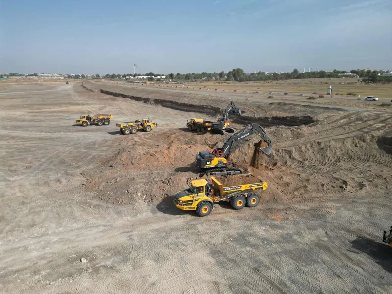 Large excavators and ADTs syncing together