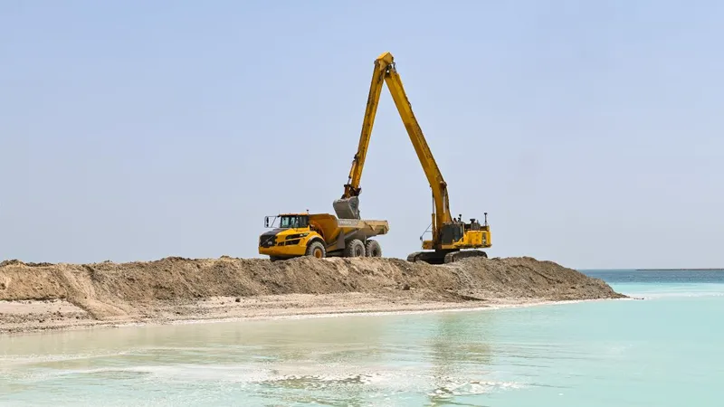 The Volvo A49G dump truck with a Komatsu 850PC excavator