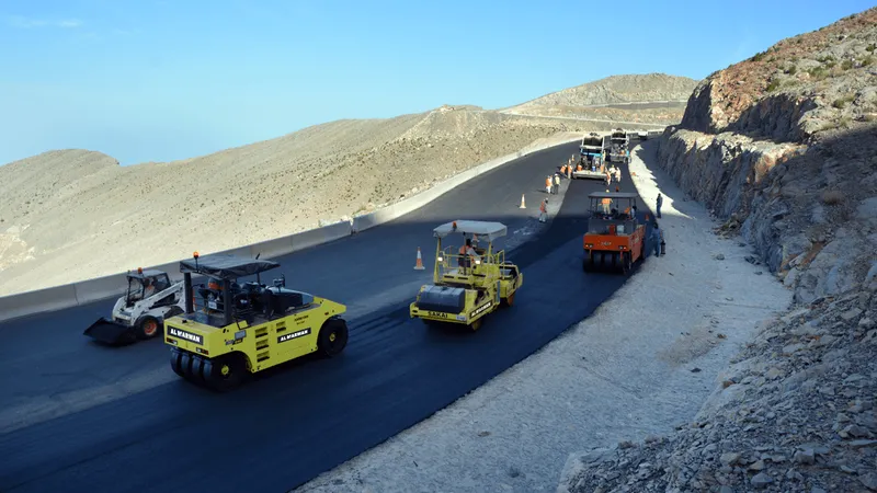 The asphalt and road marking operations conducted by Al Marwan's rental machinery fleet on Jebel Jais Road underway using Sakai and Hamm tandem and double drum rollers