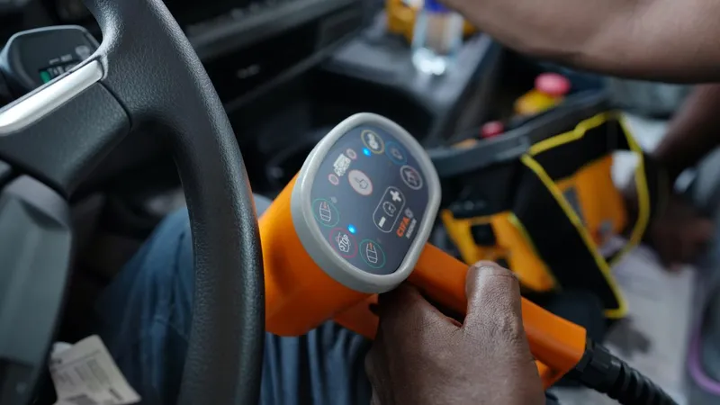 Operator holding the CIFA MK28L remote control panel