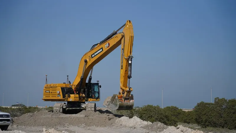 A 395 CAT excavator with the long stick configuration as part of Al Marwan Machinery's rental fleet