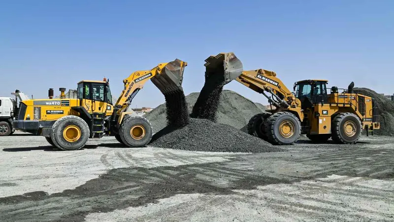 The Komatsu WA470-5 Wheel Loader and the Caterpillar 988k wheel loader