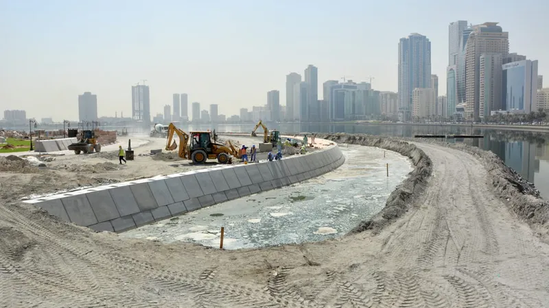A picture of various road building equipment such as the JCB 3CX backhoe loader excavating and laying foundations for the connecting road between Al Majaz Island and the waterfront