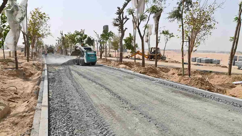 A Bobcat skid steer loader in a rental equipment for landscaping project prepares the site for forestation