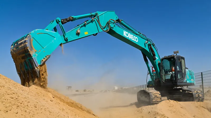 A Kobelco SK220 medium excavator on Al Marwan job site