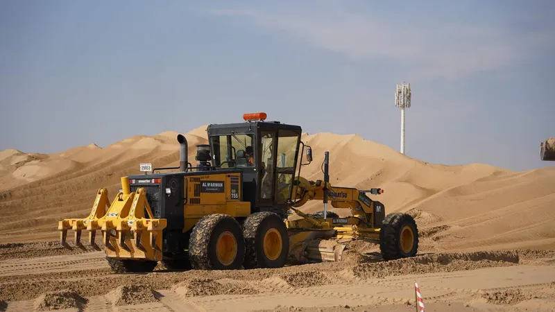 A Komatsu GD755 grader on the Hayyan by Alef work site