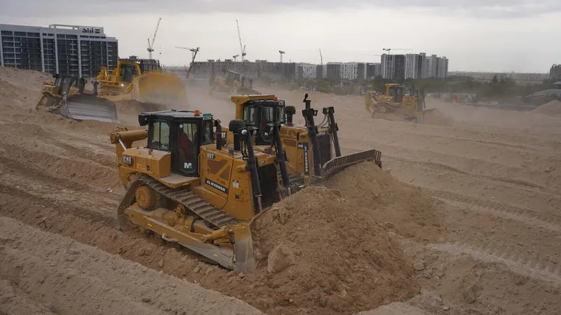 A range of Al Marwan dozers on a job site, like the CAT D8, CAT D9, Komatsu 475A & more