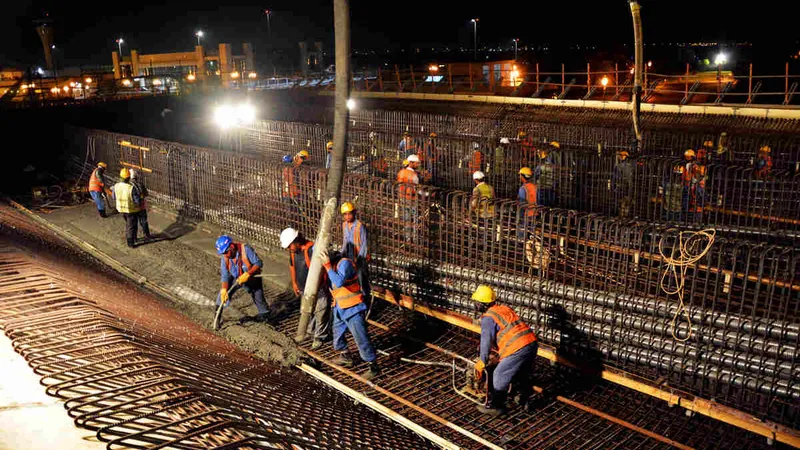 Al Marwan Construct team on a job site in the cooler temperatures during the evening hours