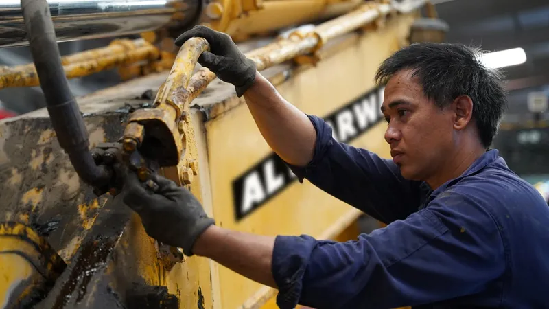 An Al Marwan heavy equipment hydraulic repair technician