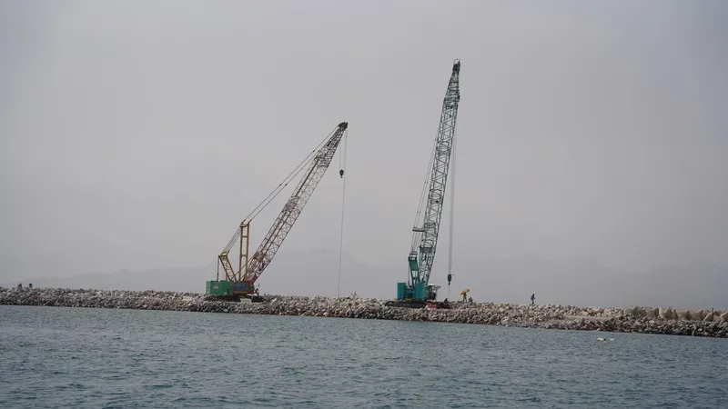 An Al Marwan Machinery Kobelco CKS1350 crawler crane on a Oman job site