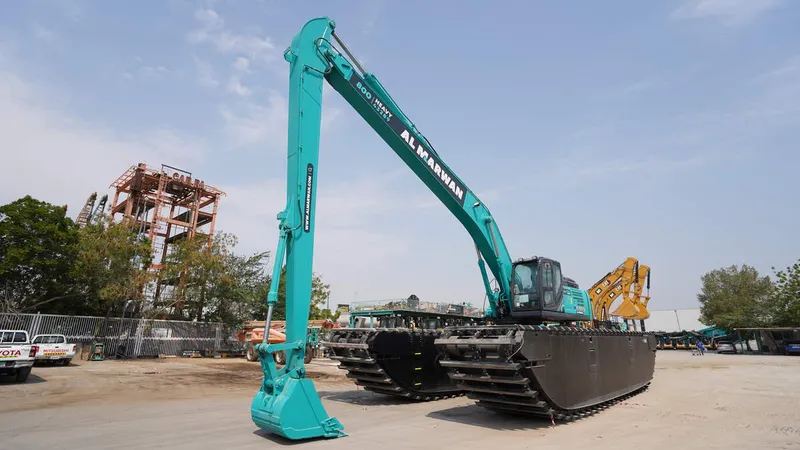 A Kobelco SK380 equipped with an amphibious undercarriage and an 18m boom