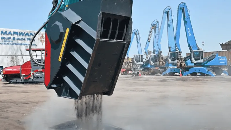 A World Attachments crushing bucket at work, sifting mixed soil
