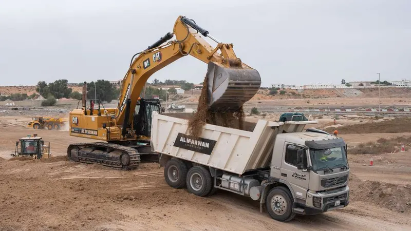 cat excavator and Al marwan dumper
