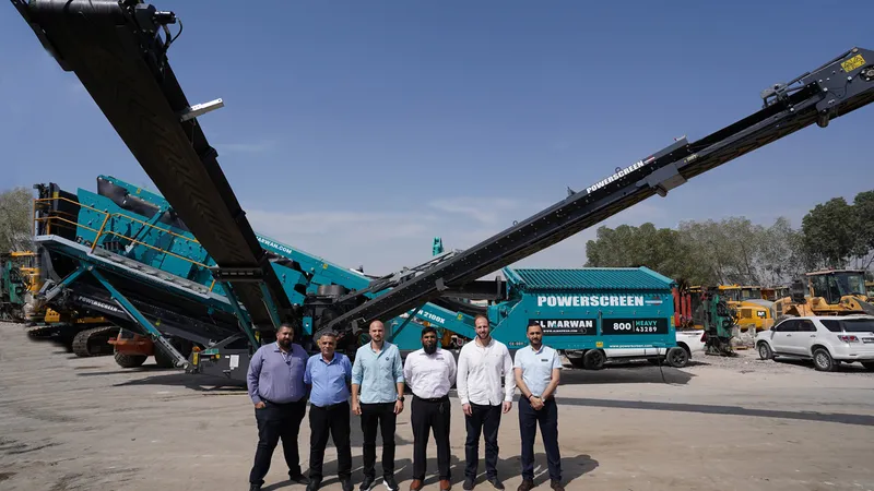 A picture documenting the visit of Powerscreen's regional sales office manager to Al Marwan's HQ standing in front of the Chieftain 2100X screener