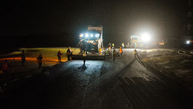 The asphalt and road marking division of Al Marwan's equipment rental fleet hard at work at night