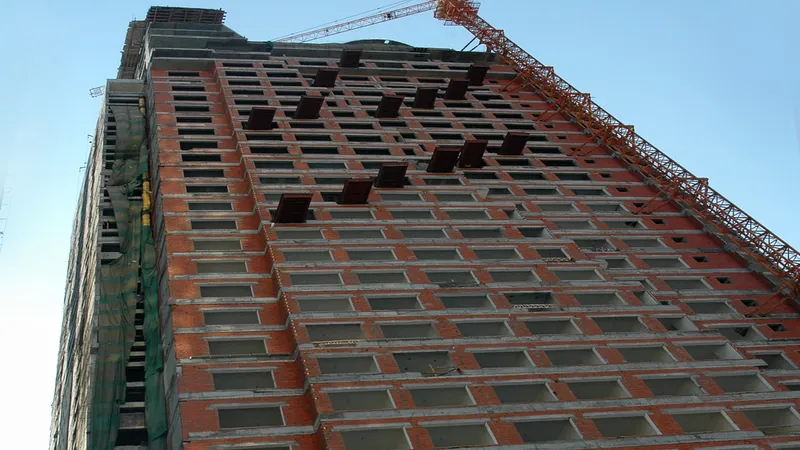 The tower cranes and stilts used in the construction of the DoubleTree by Hilton Hotel Sharjah