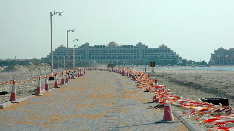 Road on Frond N of Palm Jumeirah overlooking landmarks in Dubai. Al Marwan Machinery