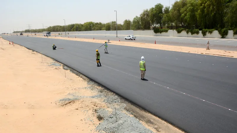 Al Marwan's asphalt division making sure the finishing progress is on schedule using machinery and brick and mortar methods