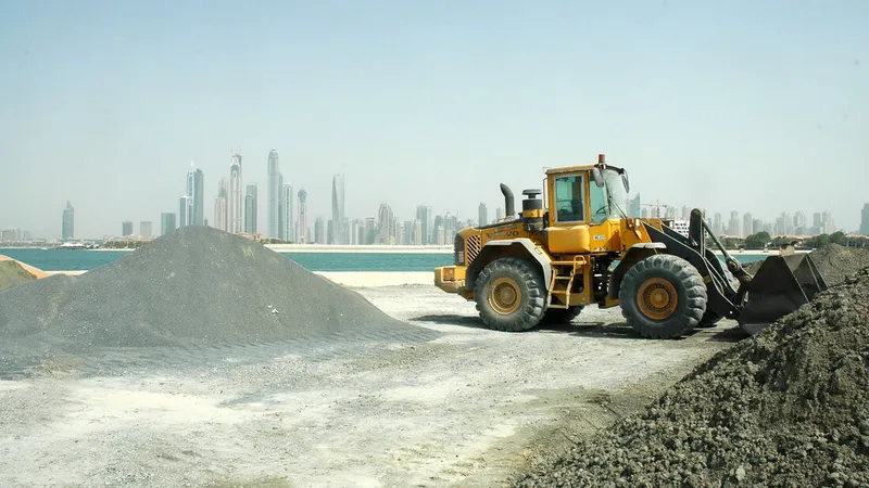 Fleet of Volvo wheel loaders at work on the Palm Jumeirah Frond N infrastructure development project. Al Marwan Machinery