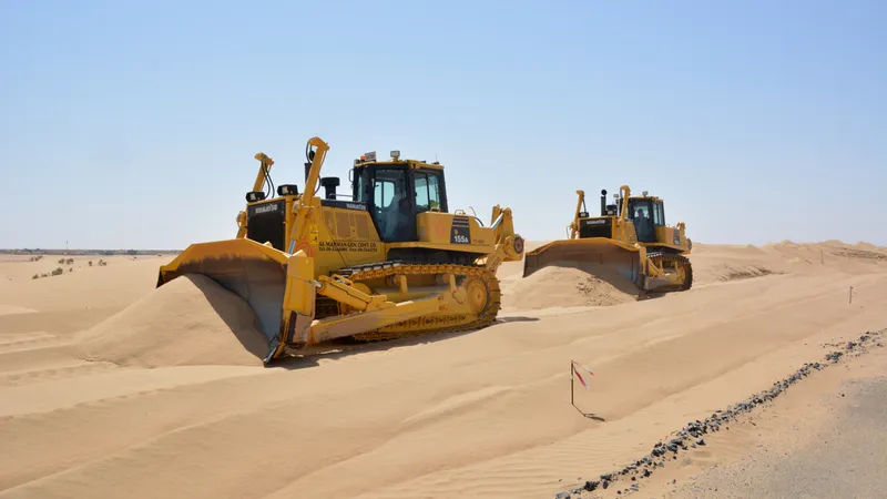 Komatsu D155A dozers grading the plot for the residential and commercial structures at Tilal City