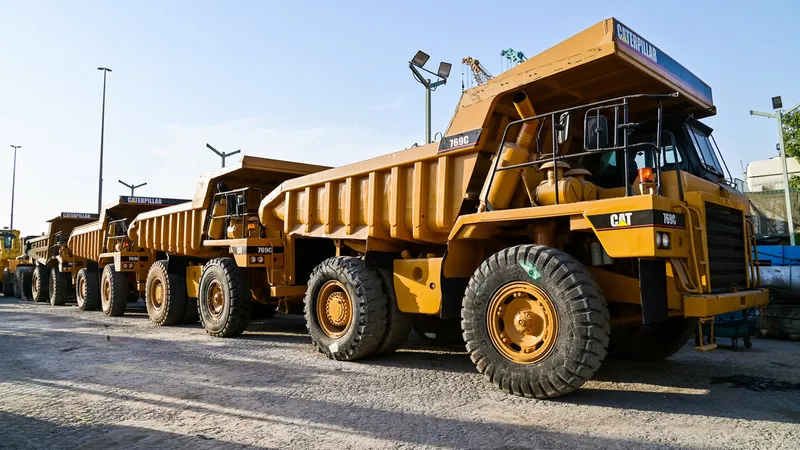 A lineup of Al Marwan's used CAT rigid dump trucks made available for sale on our Industrial Area 2 showroom in Sharjah, UAE