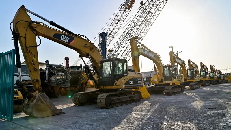 Al Marwan's lineup of CAT and Komatsu medium track excavators at our used equipment showroom in Sharjah, UAE