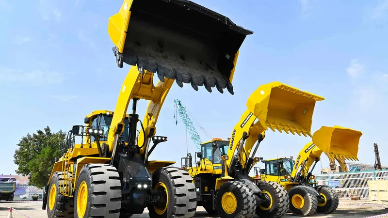 Different weight class Komatsu loaders at Al Marwan’s yard, including the WA900, WA600, WA470