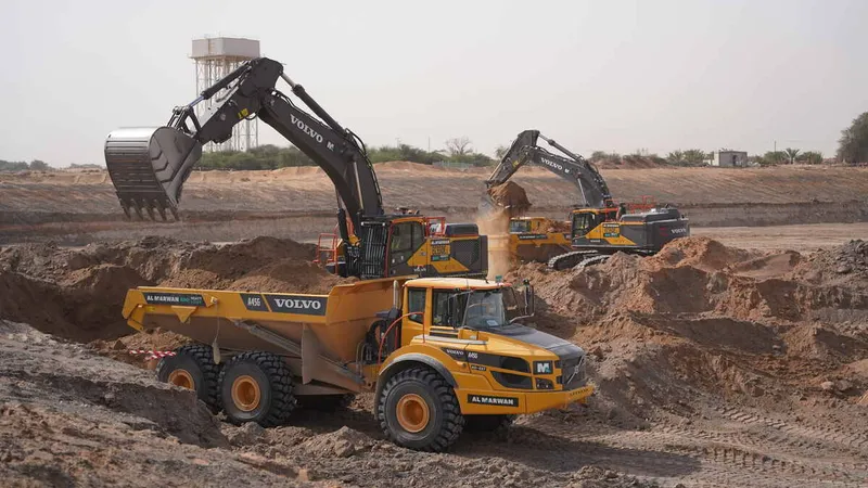 Diggers and ADTs on a job site as part of Al Marwan rental fleet