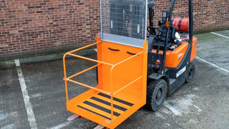 A small forklift attached t work platform