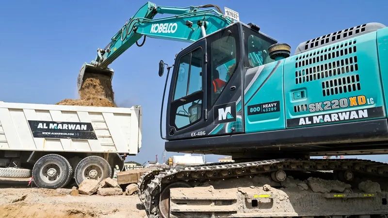 An Al Marwan Kobelco SK220 on a job site