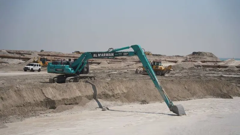 The 85-ton Kobelco SK850 long-boom excavator being operated on a sea dredging job as part of Al Marwan Heavy Machinery's equipment rental fleet in UAE