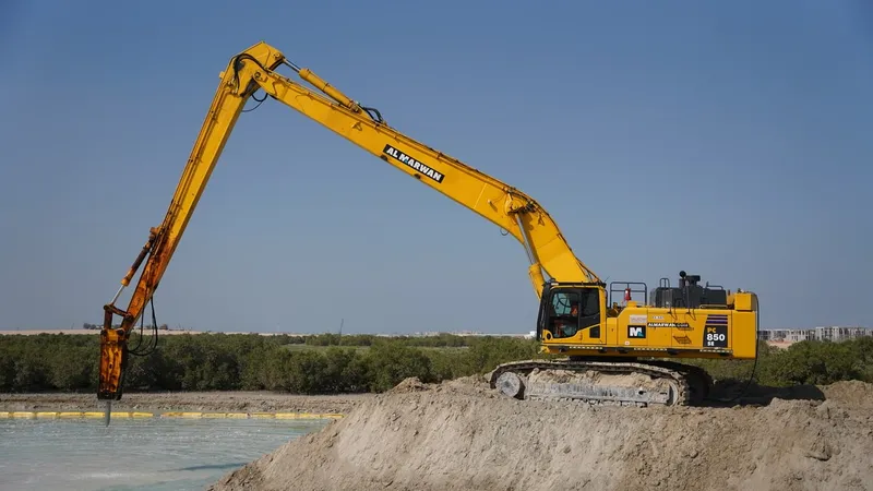A Komatsu PC850 Long Reach Digger fitted with a 21-meter boom and Jisung Jackhammer