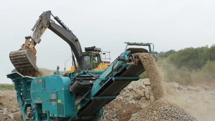 Mobile jaw crushers reduce the size of the rocks.