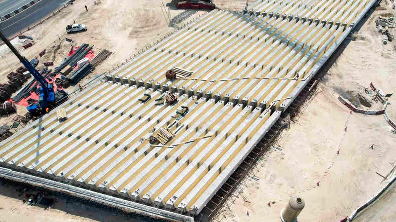 Prefabricated bridge elements being set into place by Al Marwan’s rental equipment fleet at Al Layyah job site