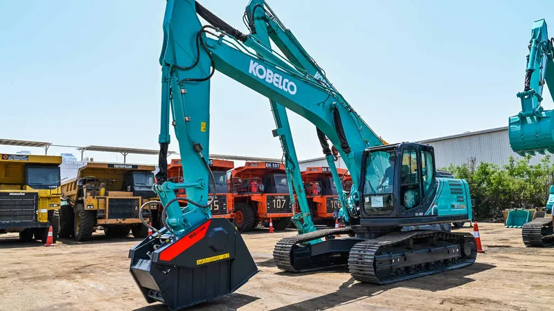 A Kobelco SK220 brand-new excavator equipped with a specialized bucket at Al Marwan yard