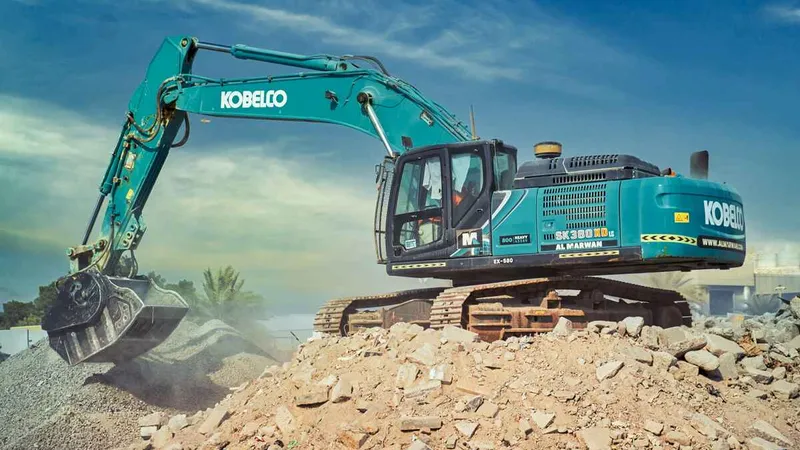 A crushing bucket attached to a Kobelco SK380 excavator.