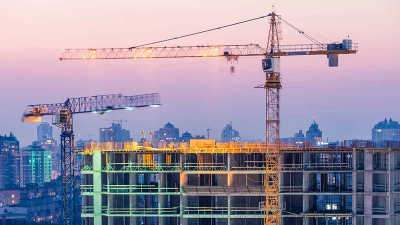 Tower cranes are fixed to the ground