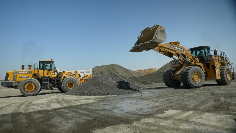 A CAT 966 loader and a Komatsu WA470 loader