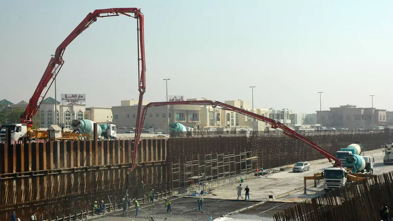 Concrete pumps and concrete mixers while working in the Al Marwan site