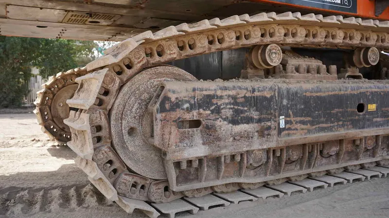 proper excavator track alignment