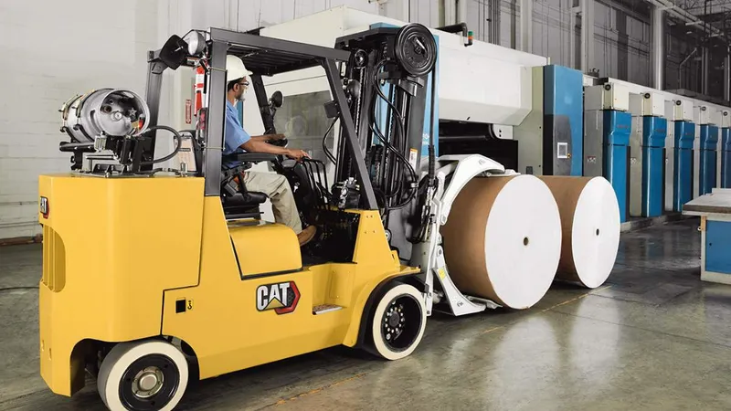 A CAT forklift attached to clamps
