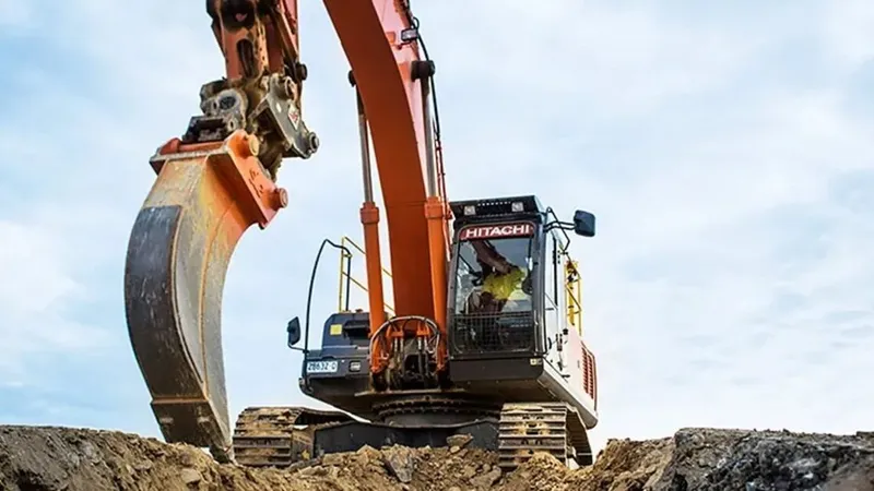 Hitachi excavator attached to a trenching bucket