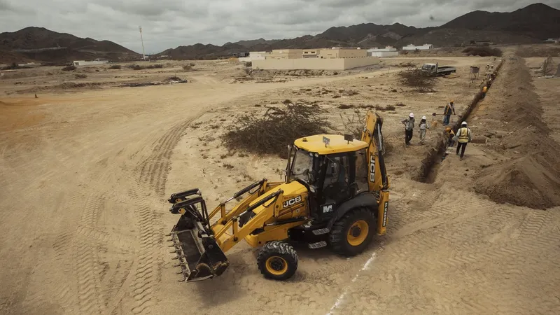 The 3CX JCB backhoe's stability is ensured through hydraulic outriggers or stabilizers.