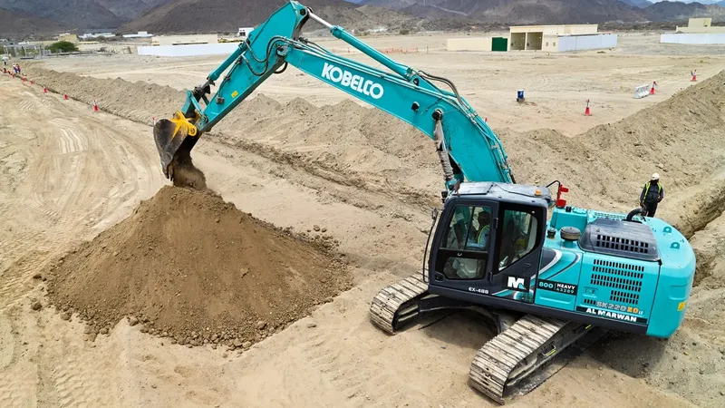A KOBELCO SK220 track excavator