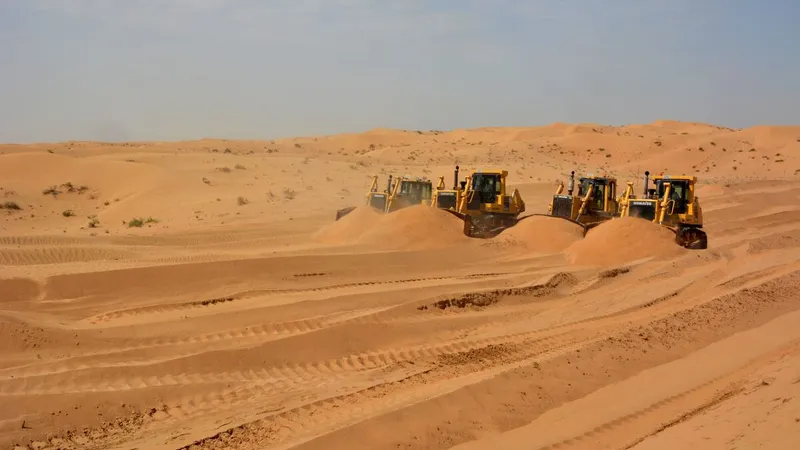multiple sized komatsu dozers